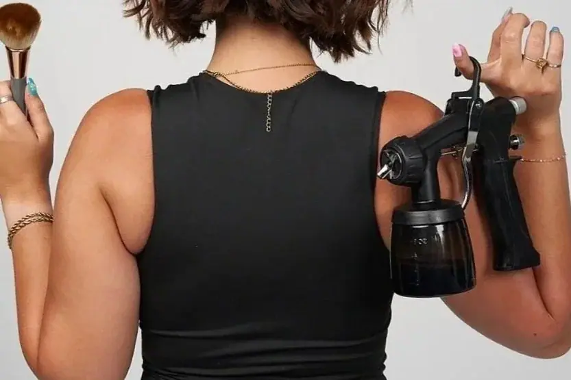 A professional spray tan being applied in the studio